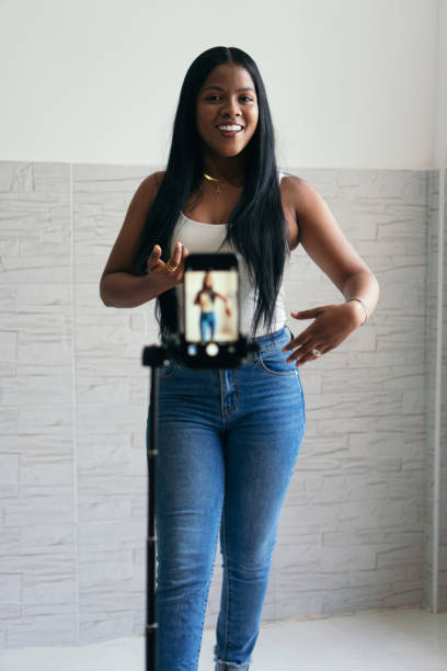 istock Woman Filming Herself Dancing Using Smartphone 1347474020