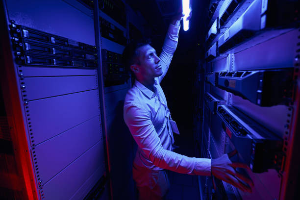 istock Data center employee monitoring cooling system in server room 1347475398