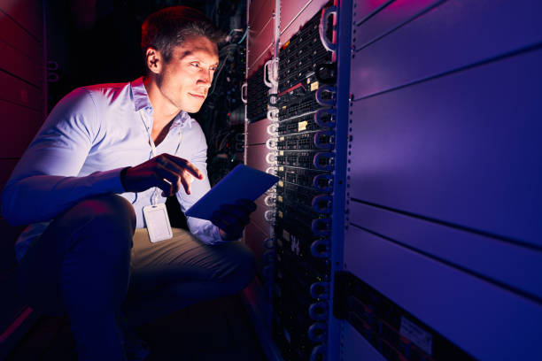 istock Focused Caucasian system administrator monitoring storage hardware 1347475453