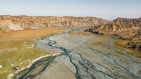 Drone textured photo of the beautiful mountain peaks and the glacial river veins in Kyrgyzstan