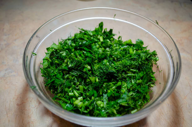istock finely cut parsley and dill in a glass bowl on a light table 1347476334