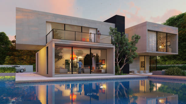 istock Big contemporary white villa with pool and garden in the evening 1347476949