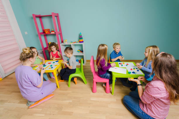 istock Rear View Of People Sitting On Table 1347477588