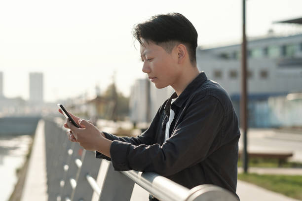 istock Young serious businesswoman looking at smartphone screen 1347478542