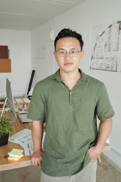 istock Young professional designer standing against his workplace 1347478692