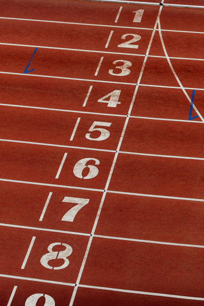 istock finish line on red track of athletics stadium 1347480085