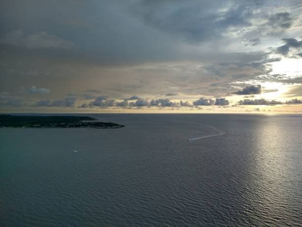 istock sunset in the Caribbean sea with clouds and island 1347482968