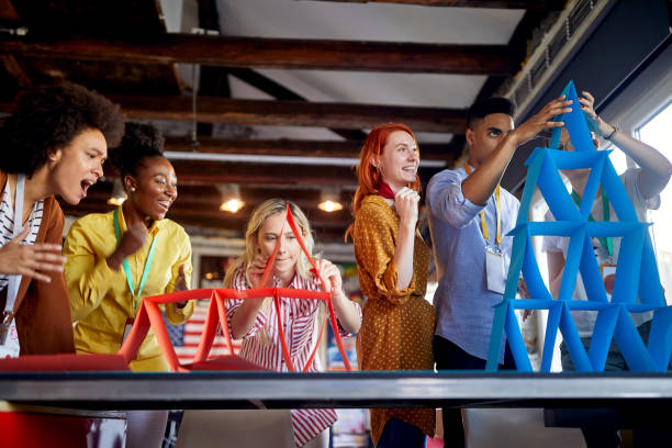 istock Group of work colleagues having fun competition together; Casual workplace concept 1347483576