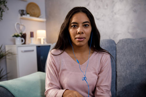 istock Young woman looking at camera as she is on a video conference call 1347484393