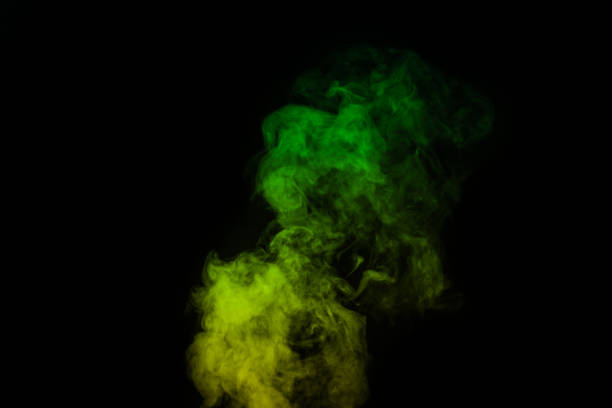 fragment of green yellow steam smoke isolated on a black background, close-up. create mystical halloween photos. abstract background, design element - toxic substance smoke abstract green imagens e fotografias de stock