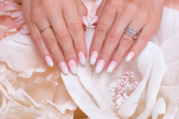 istock Female hands with ombre manicure nails 1347491207