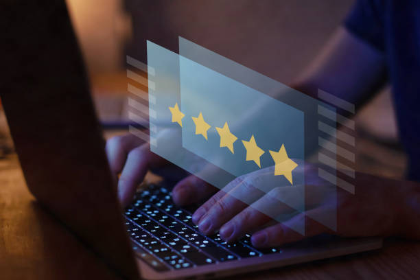 writing review on internet with 5 star rating, reputation management stock photo