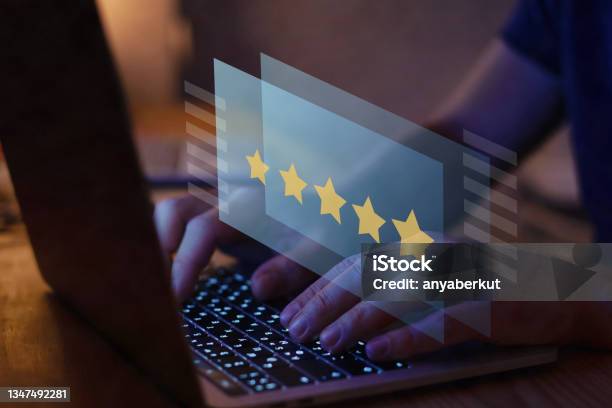 Writing Review On Internet With 5 Star Rating Reputation Management Stock Photo - Download Image Now