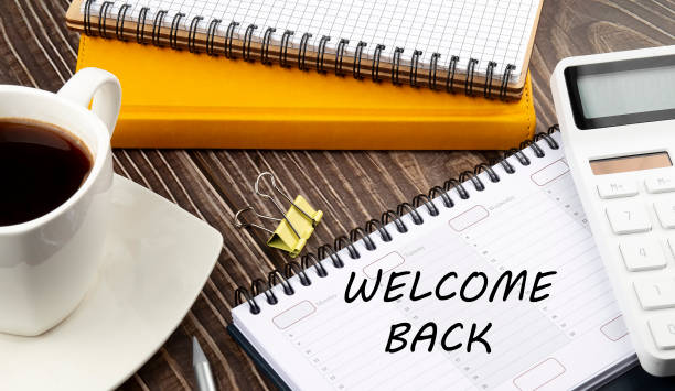 istock The words WELCOME BACK written on a calendar planner with coffee,notebook and calculator 1347493685
