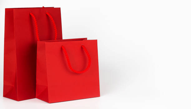 Red shopping bags isolated on white background stock photo