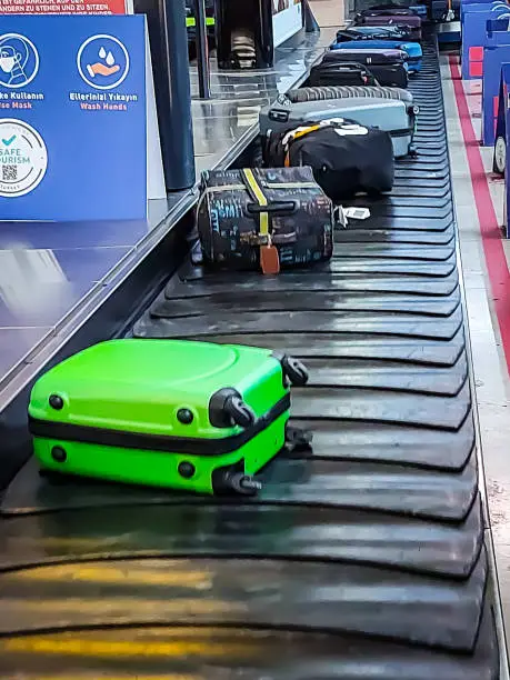 Suitcase on the conveyor belt when checking out