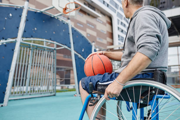 istock Man with disability playing basketball 1347496833