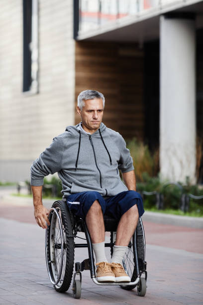 istock Man with disability walking outdoors 1347496854