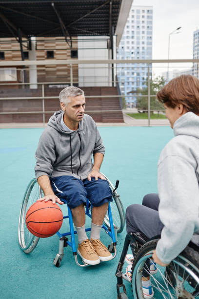 istock Paraplegic people playing basketball 1347496918