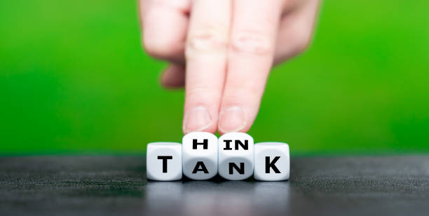 Dice form the expression "think tank". stock photo