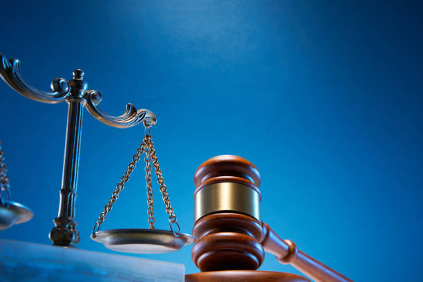 istock gavel hammer and  libra scale against blue background 1347498628