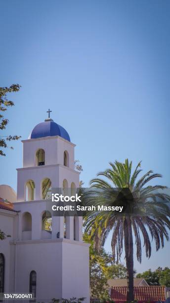 Small Catholic Church With Bell Tower Surrounded By Palm Trees On California Beach Town Stock Photo - Download Image Now