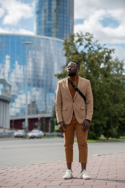 istock Young businessman standing on bus stop in the morning 1347501236