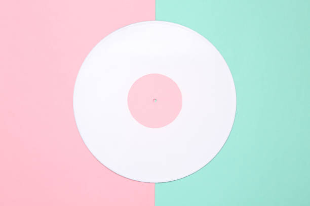 istock Music creative layout. White vinyl record on pink blue background. Top view. Flat lay 1347503328