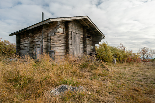 Traditional wooden cabin in Finnish Lapland. One of the huts in Pallas-Yllastunturi national park, Finland. Autumn day in remote arctic landscape