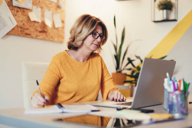 istock Mature woman working remotely 1347506364