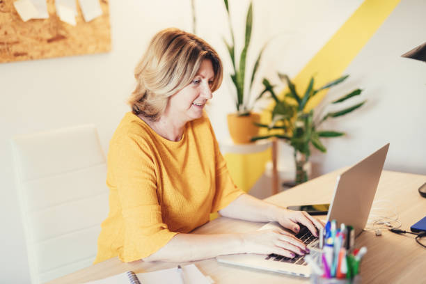 istock Mature woman working remotely 1347506426