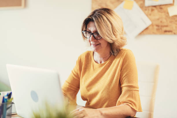 istock Mature woman working remotely 1347506427