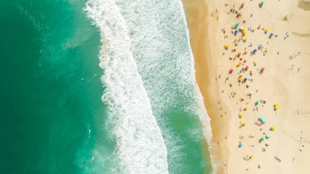 istock Tropical beach aerial view. Waves break on tropical yellow sand beach. 1347507750