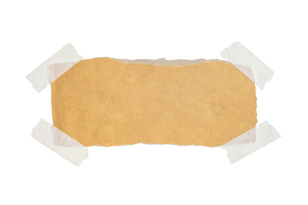istock Brown paper labels attached with sticky tape on white background 1347510073
