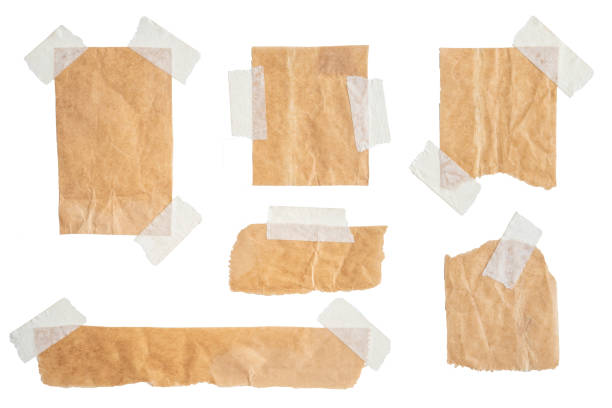 istock Brown paper labels attached set with sticky tape on white background 1347510110