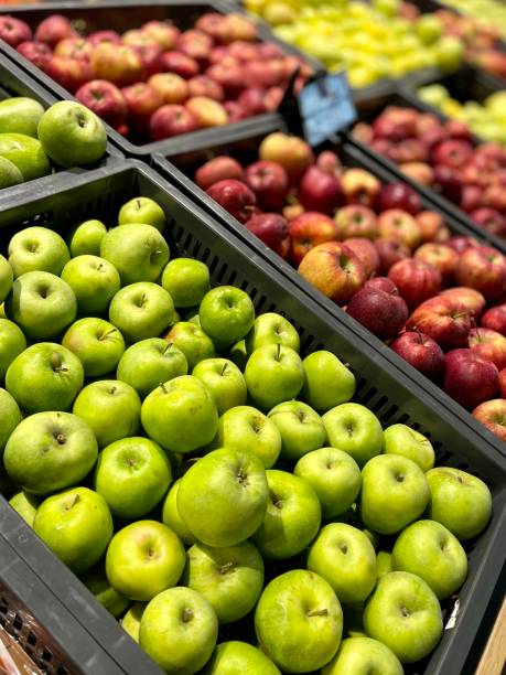istock Red and green apples in the market 1347510269