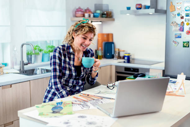 istock Attractive woman doing a drawing with a pencil in the notebook 1347510530