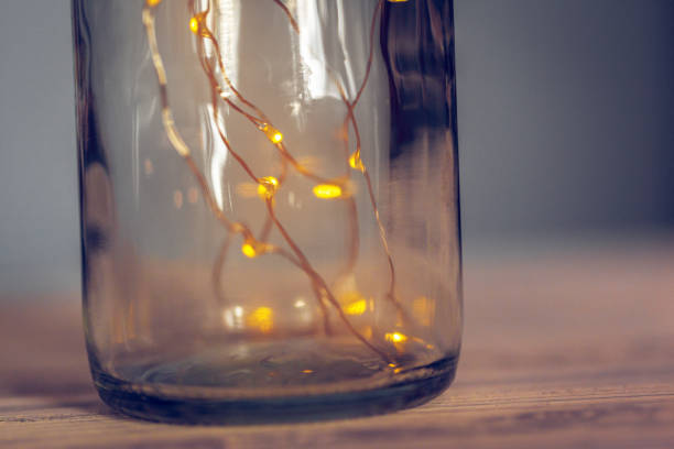 istock Lights garland in a glass bottle on a dark background 1347511993