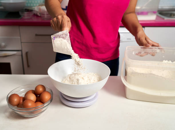 istock a woman weighs flour to make a sponge cake 1347512852