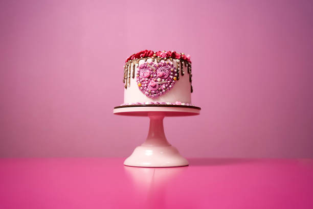 istock a cake with a heart on a pink background 1347512860