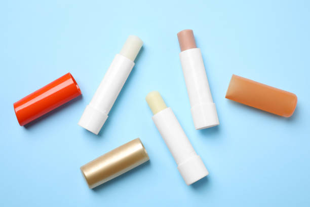 istock Hygienic lipsticks on light blue background, flat lay 1347516001