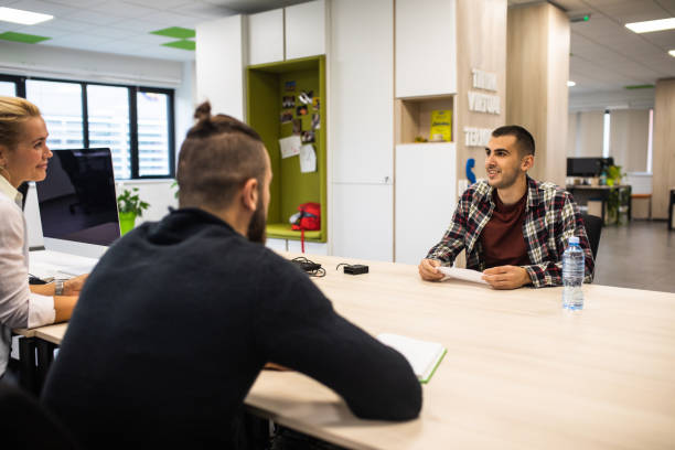 istock A young man impressing interviewers in a job interview 1347516031