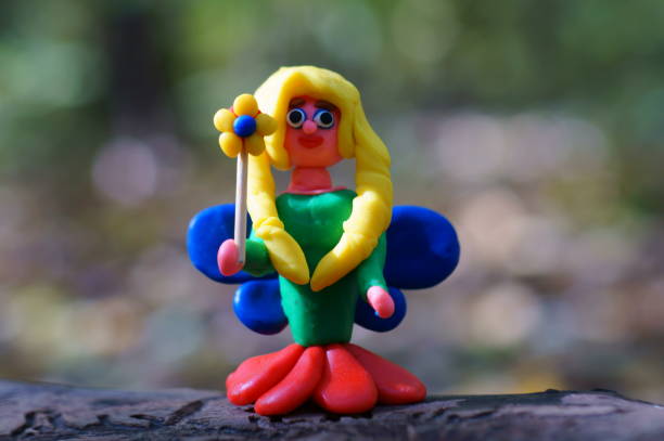 istock Toy fairy close-up on a colored background. 1347517124