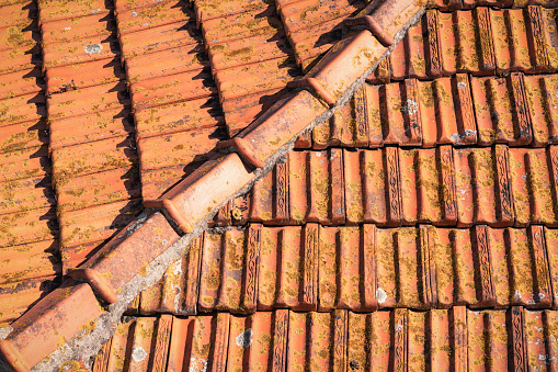 The corner of the tiled roof of a house in Lisbon, Portugal.