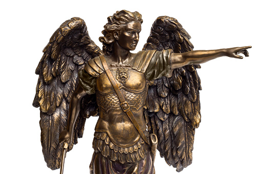 Bronze statue of Saint Michael on an isolated white background.