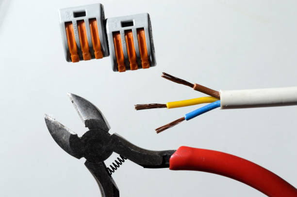 istock nippers, wire and terminal blocks on a light background. close-up top view. 1347525875