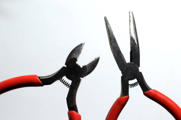 istock nippers with red handles close-up top view. 1347525878