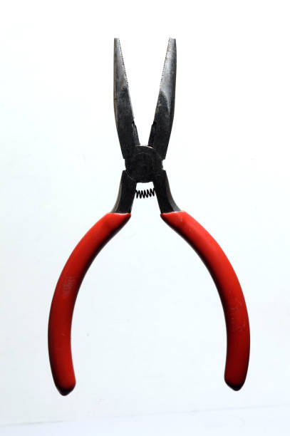 istock nippers with red handles close-up top view. 1347525882