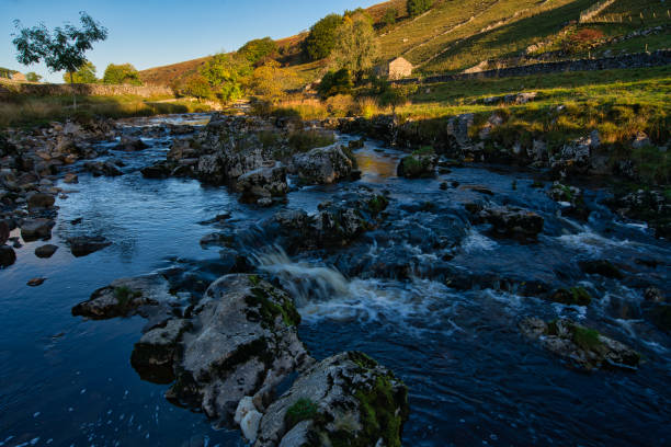 istock River Wharfe flowing over rocks in rural setting, Langstrothdale, Yorkshire Dales National Park, North Yorkshire, England, Britain 1347528598