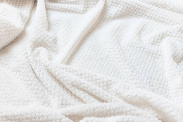 istock Beige soft background of fleece blanket 1347531108